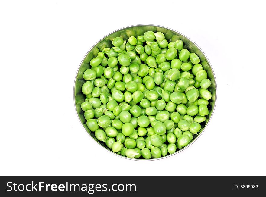 Green peas in bowl isolated on white.