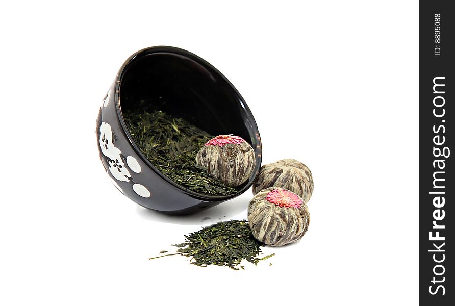 Different types of green tea and a small oriental style cup