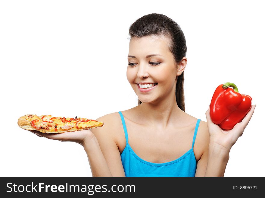 Beautiful young woman with pizza in one hand and red pepper in other one. Beautiful young woman with pizza in one hand and red pepper in other one