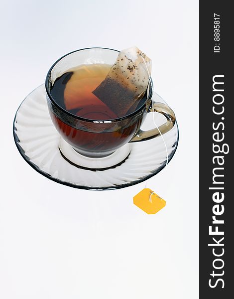 Cup of quick-dissolving tea standing on sauser. Cup of quick-dissolving tea standing on sauser