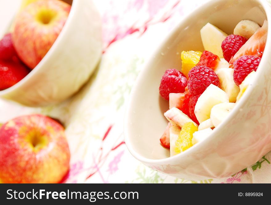 Salad fruit on strawberries oranges and banana and apple in a cup. Salad fruit on strawberries oranges and banana and apple in a cup