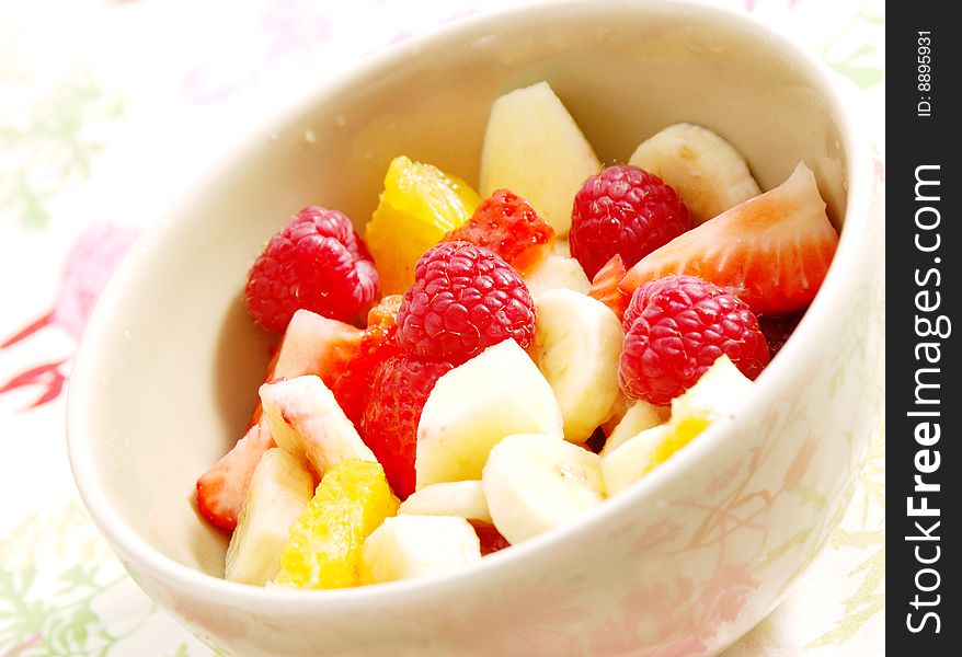 Salad fruit on strawberries oranges and banana and apple in a cup. Salad fruit on strawberries oranges and banana and apple in a cup