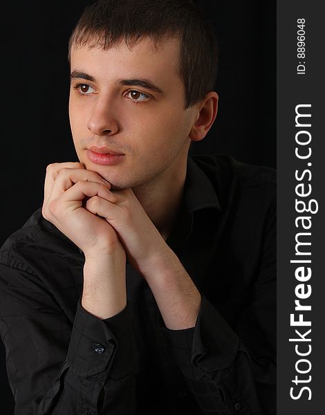 Portrait of serious young man in shirt. Portrait of serious young man in shirt