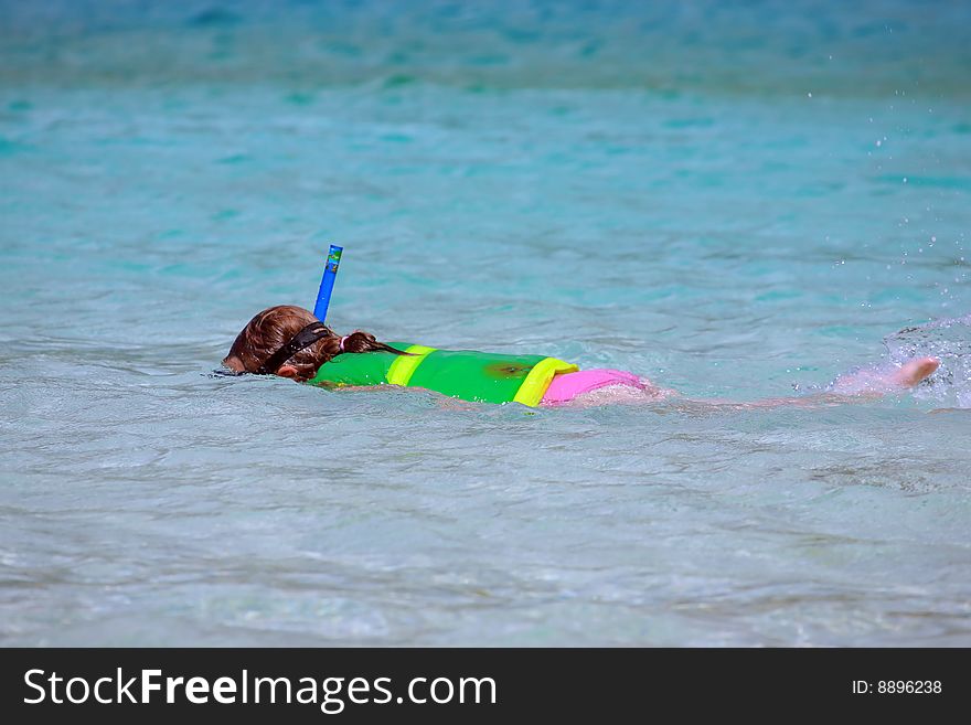 Snorkel girl in turquoise water