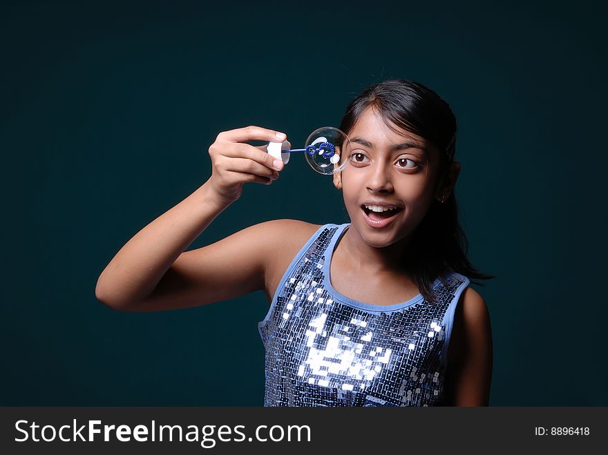 Girl Holding A Soap Bubble