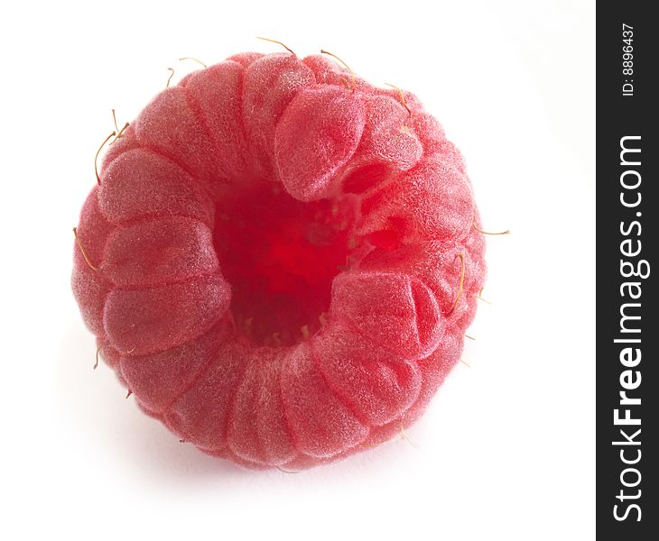 Fresh raspberry fruit on table