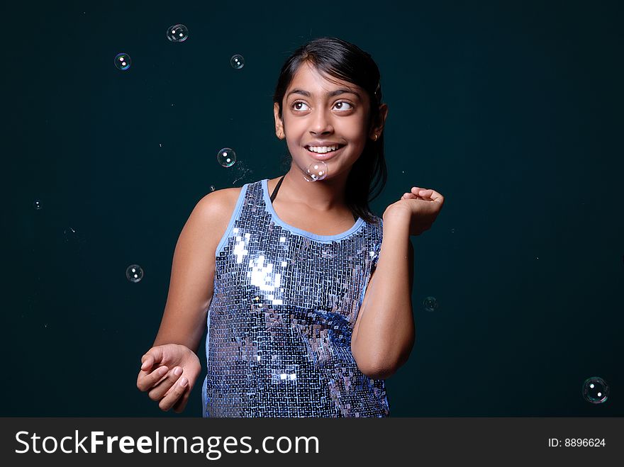 Girl dancing with soap bubbles