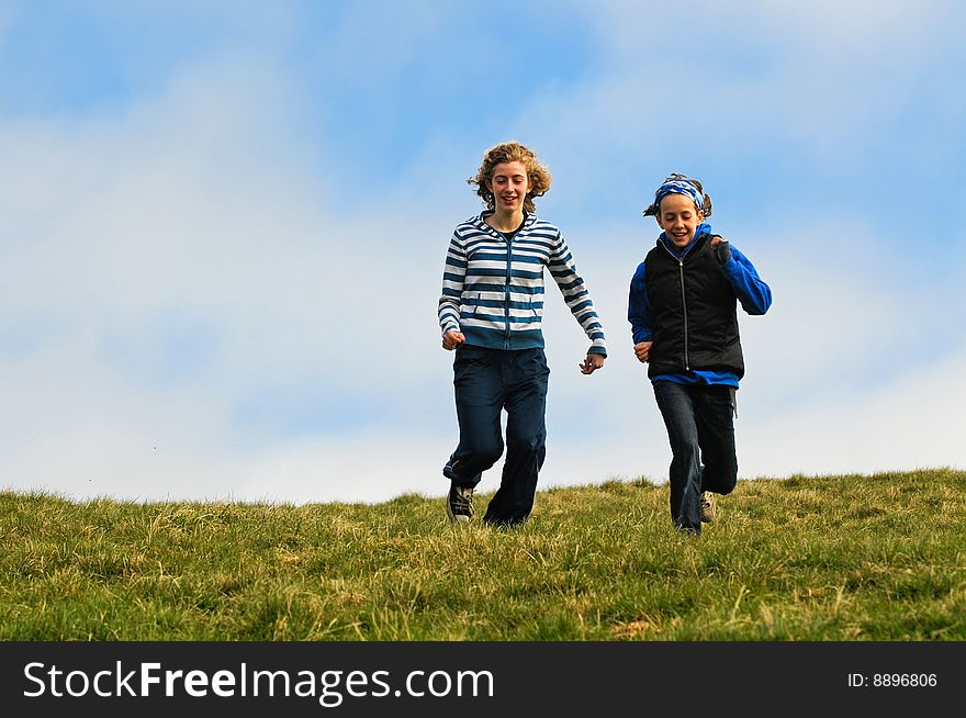 Action shot of girls running down a hill