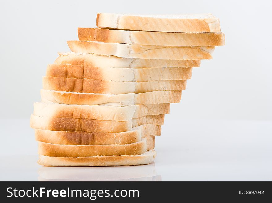 Picture of a white bread loaf sliced