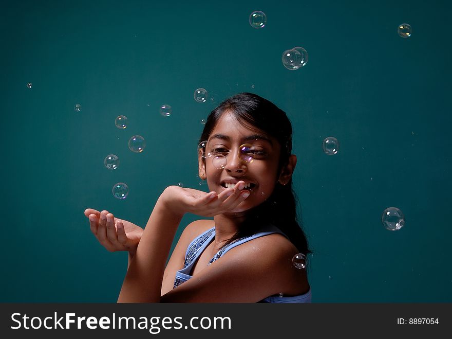 Girl Playing With Surrounded Bubbles