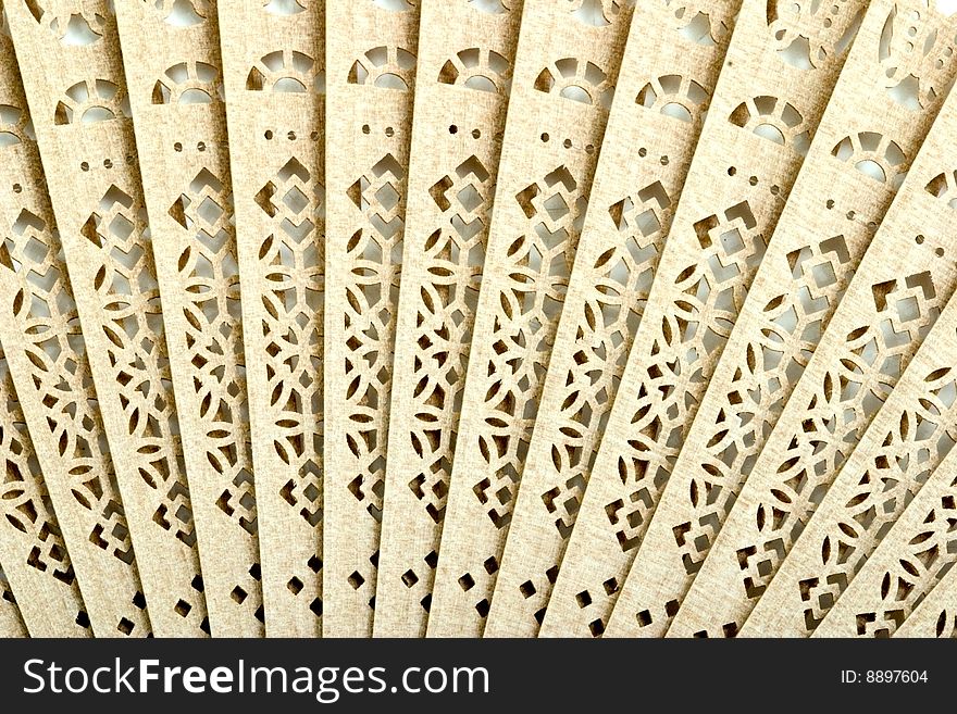 Decorative wooden Japanese fan with ornament