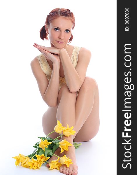 Cute young woman with yellow tulips. Cute young woman with yellow tulips