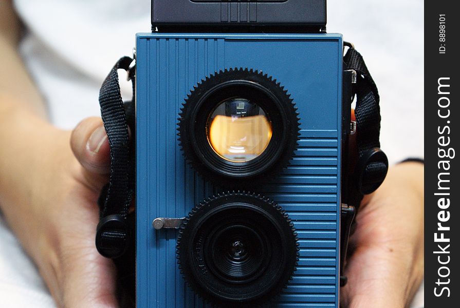 A twin-lens reflex toy camera made of plastic