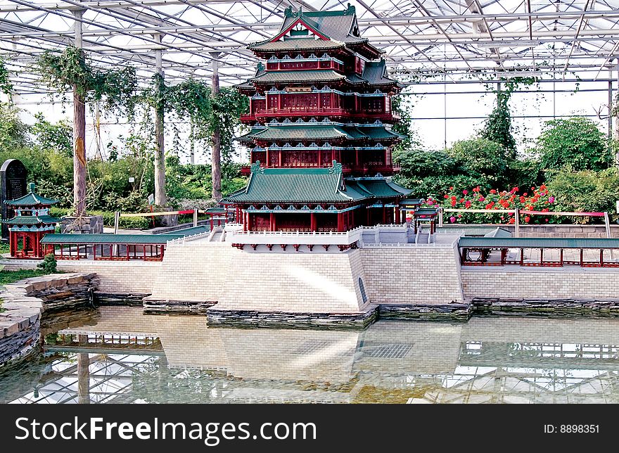 Chinese ancient building,model of traditional building. it lies in Hunan of China. Chinese on the board is peaceful floor.