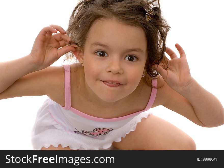 Little girl holding hands over ears and laughing. Little girl holding hands over ears and laughing