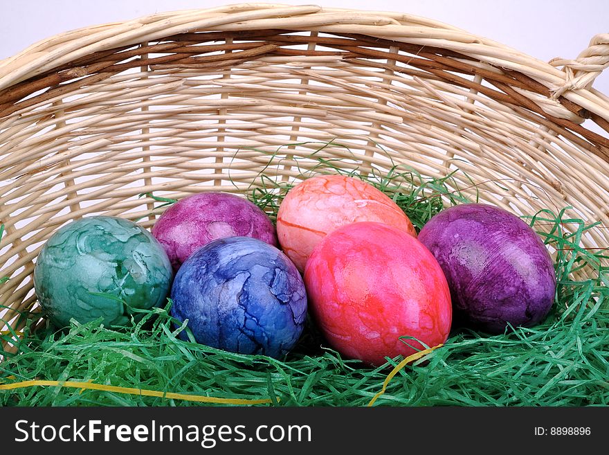 Colorful Easter eggs in one basket