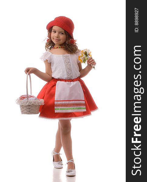 Little girl in a red dress and hat holds basket and flowers. Little girl in a red dress and hat holds basket and flowers