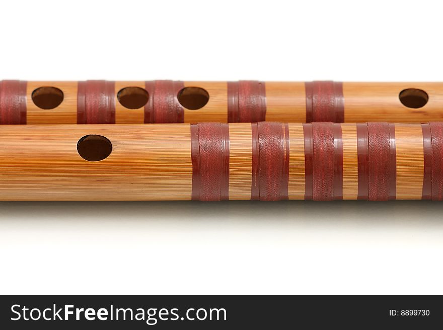 A dizi (Chinese transverse flute) isolated on white background. A dizi (Chinese transverse flute) isolated on white background.