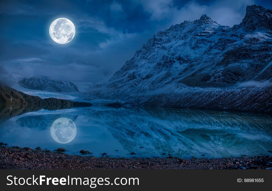 Full Moon Near Snowcap Mountain