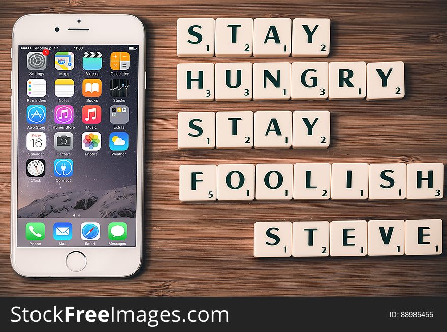 An iPhone with the Steve Jobs quote "Stay hungry stay foolish".