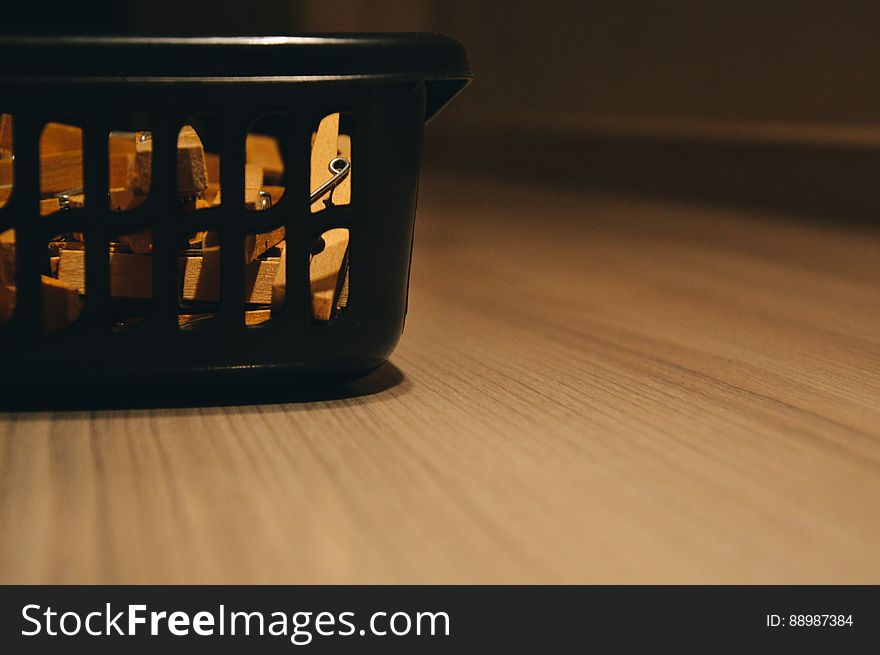 Washing Basket On Wooden Floor