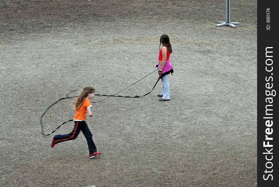 Two girls playing with a thong and horsewhip. Two girls playing with a thong and horsewhip