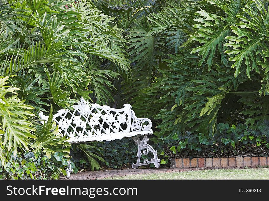 White bench in garden
