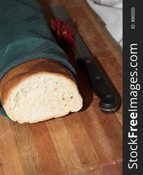 Bread in napkin with knife. Bread in napkin with knife