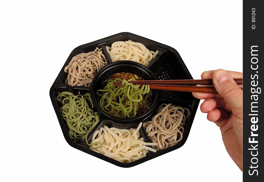 Soba lunch box with a hand and chopsticks isolated over white background with clipping path. Soba lunch box with a hand and chopsticks isolated over white background with clipping path