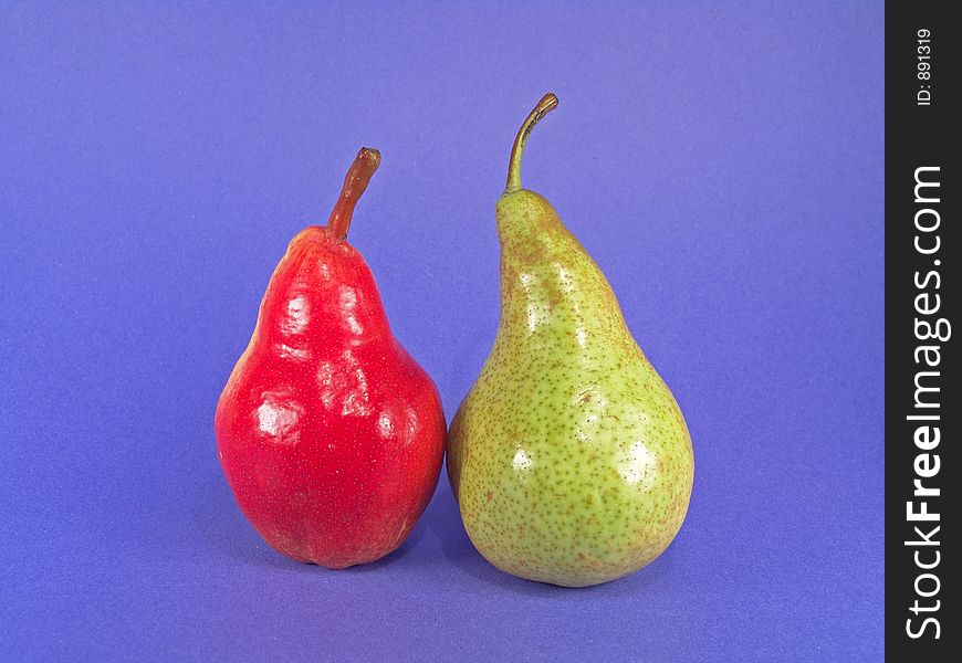 A red and a green European certified organic pears. A red and a green European certified organic pears.