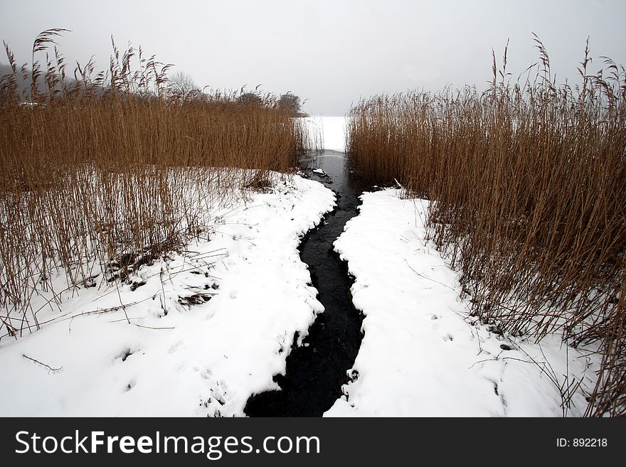 Winter river under the snow