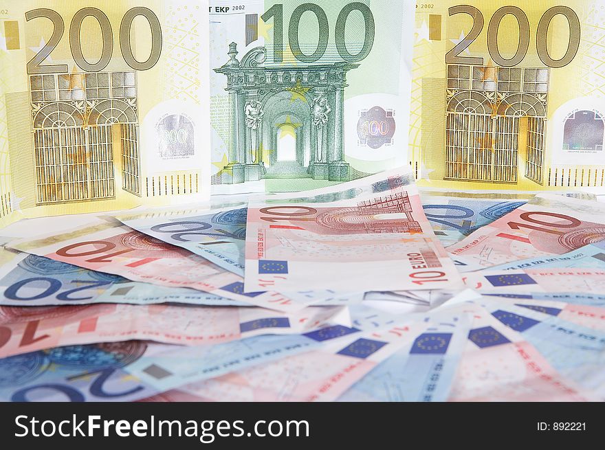 A circle made of european papermoney with big notes in the background. A circle made of european papermoney with big notes in the background