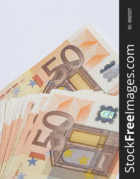 A pile of european papermoney on white background. A pile of european papermoney on white background