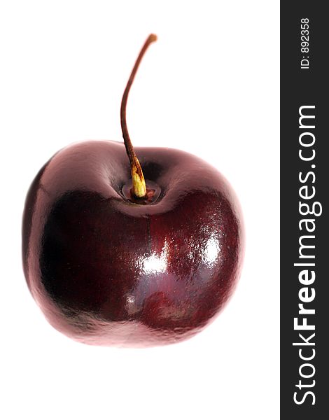 The image of a sweet cherry with a drop on a white background. The image of a sweet cherry with a drop on a white background