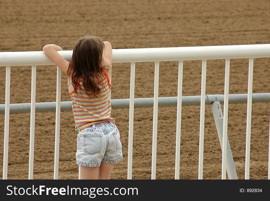 Young girl at horse track. Young girl at horse track