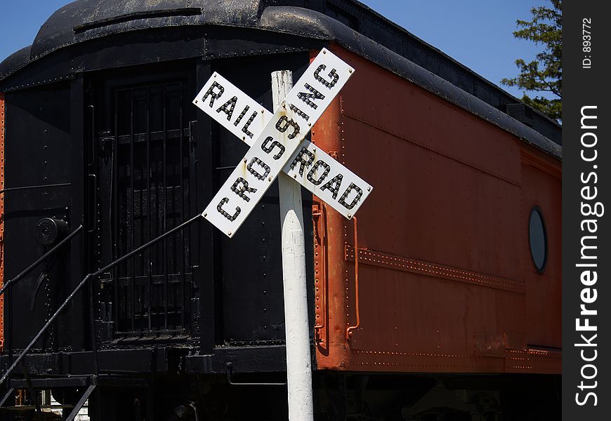 Museum Exhibit of Railway Car and Railroad Crossing sign