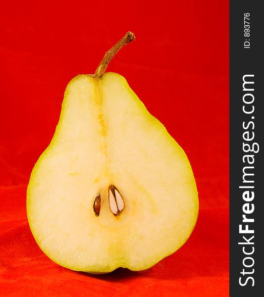 Pear on red background