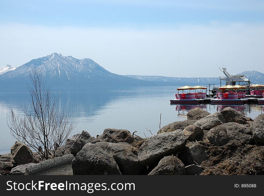 Lakeside with mountain and japanese dinghy. Lakeside with mountain and japanese dinghy