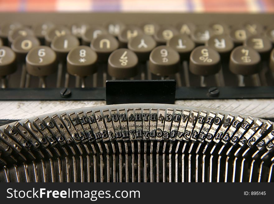 A vintage portable typewriter with ink ribbon