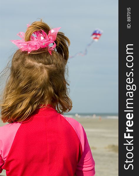 Little girl flying kite at beach. Little girl flying kite at beach