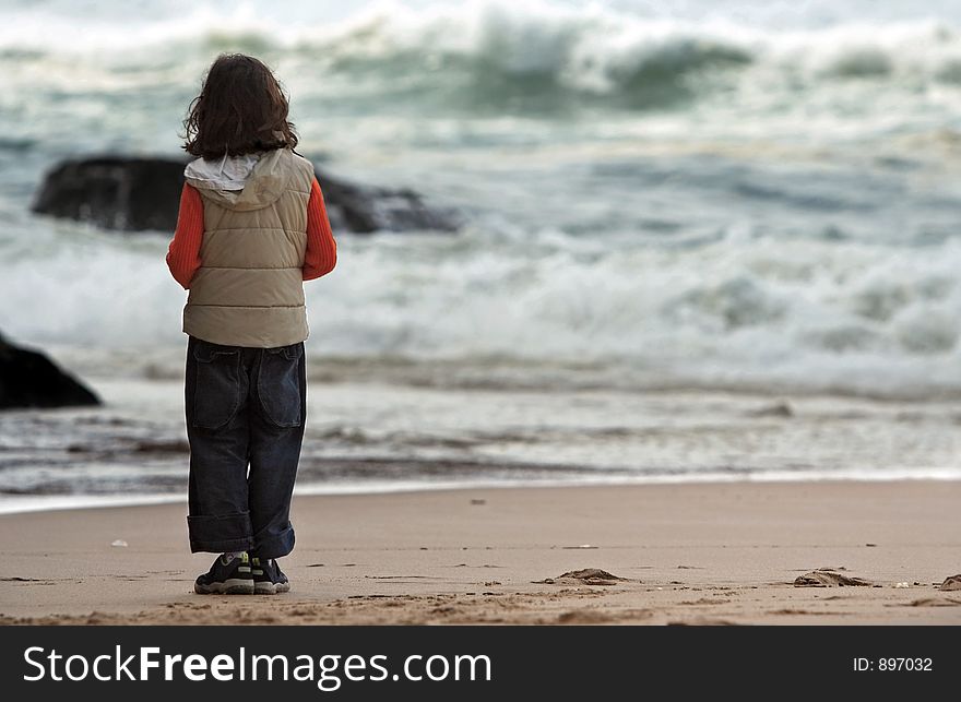 Girl looking at the view at the beach. Girl looking at the view at the beach