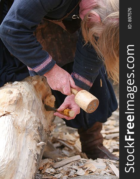 A craftsman working wood the oldfashioned way,. A craftsman working wood the oldfashioned way,