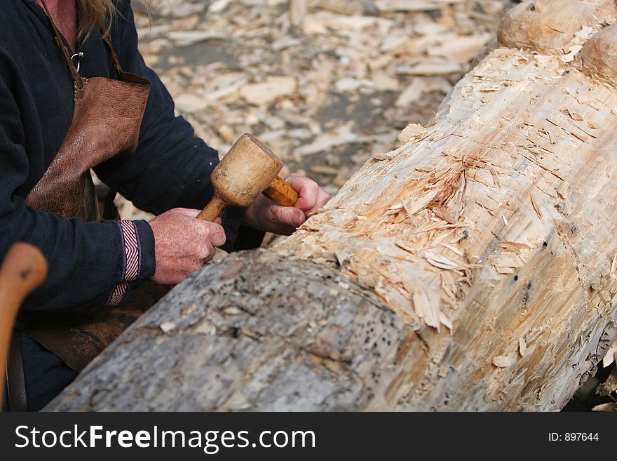 A craftsman working wood the oldfashioned way,. A craftsman working wood the oldfashioned way,