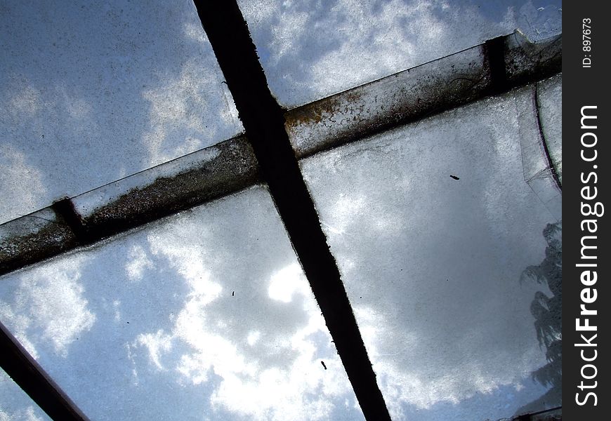 A cloud background as seen through some dirty abstract windows. A cloud background as seen through some dirty abstract windows