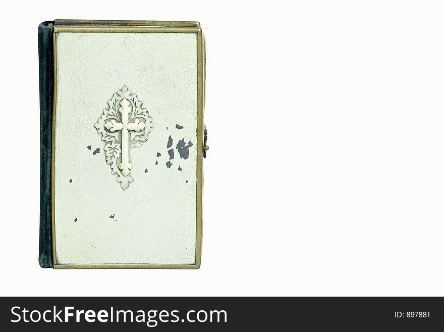 A vintage Bible isolated on a white background.