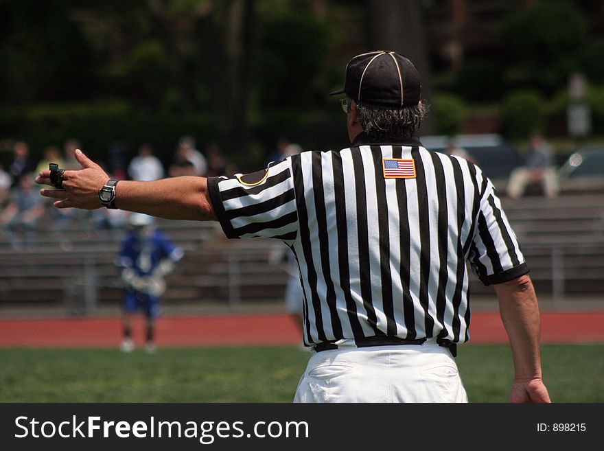 Referee making the call. Referee making the call.