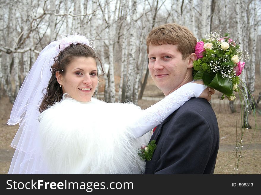 Portrait newlyweds in park. Portrait newlyweds in park