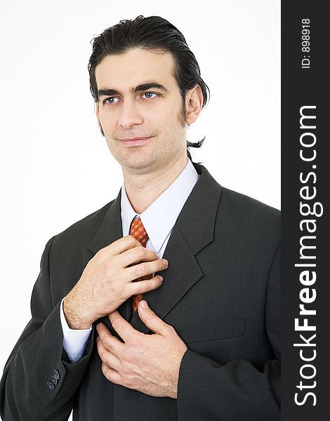 Businessman fixing his tie. Businessman fixing his tie