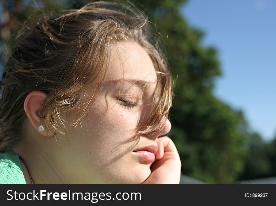 Teenage girl contemplation in sunlight. Teenage girl contemplation in sunlight