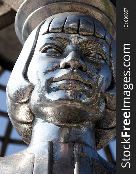Steel statue of a female's face. Steel statue of a female's face.